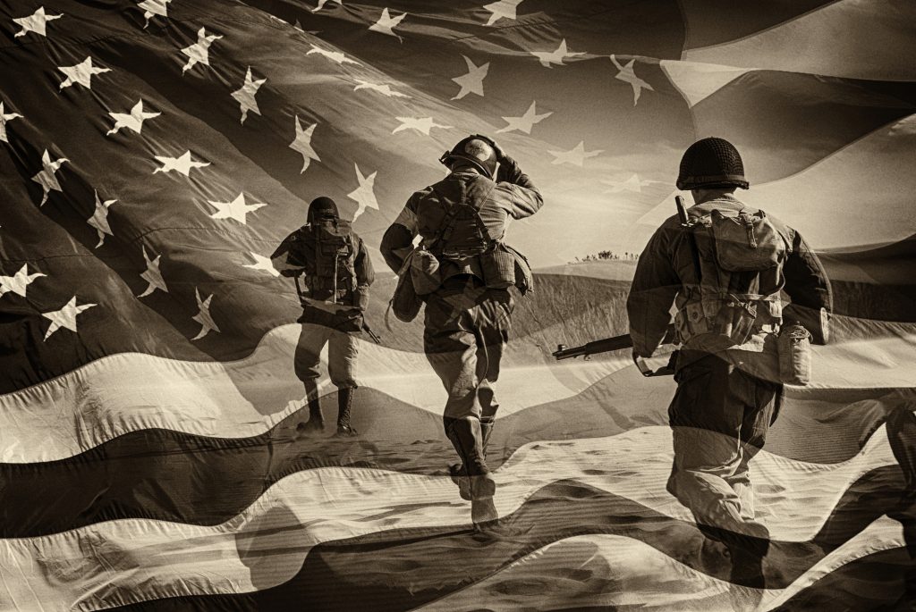 Three Active Duty American Soldiers Running Through a horizontal image of a field of stars and stripes. Battle ready and running. Sepia Toned. Grain. Composite Image.